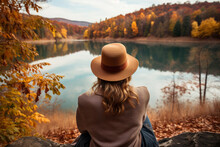 Woman Enjoying The View Of The Colorful Autumn Forest And Lake, Generative Ai