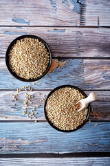 Wall Mural - Dried Green Buckwheat porridge in a bowl