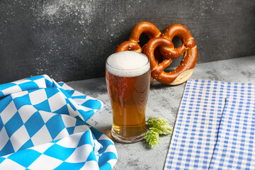 Flag of Bavaria, mug with beer and pretzels on grey table