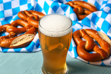 Flag of Bavaria, mug with beer and pretzels on blue background