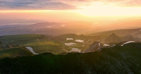 Wall Mural - sunrise above bulgarian mountain peaks, hills, seven rila lakes and clouds, 4k video nature of bulga
