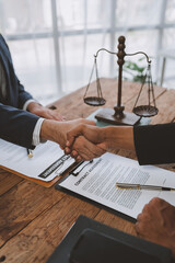 Wall Mural - Lawyers join hands with business people to sign a partnership agreement on cooperation agreements related to joint financing of financial business. concept of justice, real estate