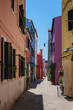 Burano Island, Venice, Italy - June 22, 2023: Colorful house facades on Burano Island