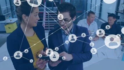 Poster - Animation of network of profiles over diverse businessman and businesswoman discussing at office