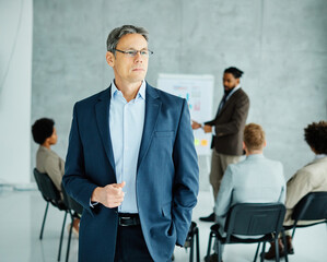 Wall Mural - young business people meeting office portrait man businessman teamwork group success corporate colleague partnership together startup creative start up beginning start senior mature