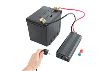 connecting a network wire to a power inverter, connected to a 12v battery, a DC to AC converter, on an isolated white background