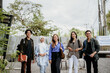 © Odua Images - smiling group of Asian students standing in an outdoor coworking space