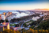 Fototapeta Miasto - view over Malaga at sunset travel banner