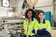 women worker team staff employee in industry factory happy smiling portrait standing together multiracial