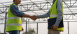 © Shisu_ka - Construction worker team hands shaking greeting start up plan new project contract in office center at construction site, industry ,architecture, partner, teamwork, agreement, property, contact
