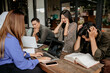© Odua Images - stressed out group of students working on an assignment using a laptop computer in an outdoor coworking space