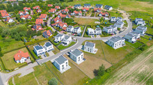 Aerial Of New Construction Luxury Residential Neighborhood Street Single Family Homes Real Estate