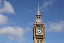 Big Ben Clock Tower In London, UK In A Day With White Clouds And Blue Sky.