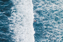 Aerial View Of A Surfer On A Wave In Famara Beach, Lanzarote, Spain.
