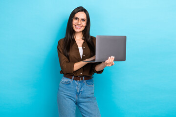 Poster - Photo of cute cheerful lady wear brown shirt spectacles working modern gadget isolated blue color background