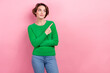 © deagreez - Photo of charming young marketer woman promoter wear green jumper look interested advert presentation isolated on pink color background