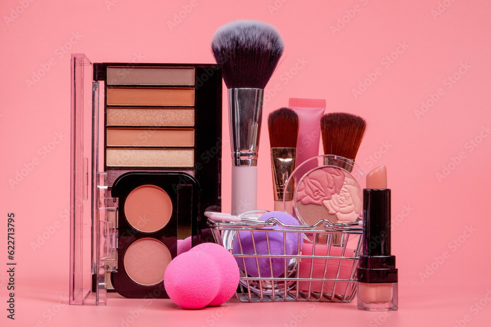 Professional makeup tools. Makeup products on pink background. A set of ...