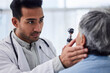 © Nadia L/peopleimages.com - Man, doctor or old woman in eye test assessment in clinic for healthcare, wellness or vision examination. Patient, visual or client testing a mature optician or optometrist in optometry consultation