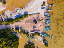 Aerial View Of The Resting Area Of Fishermen With Fishing Boats Docked Along The Shore At Chelem, Yucatan, Mexico.