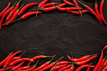 Wall Mural - Red hot chili pepper flat lay. Spicy seasoning background