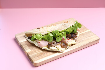 Wall Mural - Italian cuisine , Piadina with Italian ham and cheese