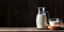 Fresh And Organic Milk In Glass On Rustic Wooden Table On Dark Background For Your Product Showcase With Copy Space