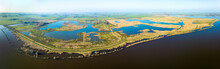 Aerial Panorama Of The Entire Nature Reserve Tetjehorn With Reed Swamp And Lakes, Seen From Lake Schildmeer, 't Roegwold, Province Of Groningen, The Netherlands.