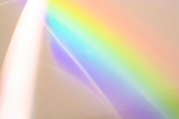Flash on the wall. Blurred rainbow light. Dispersion. Decomposition of light into spectral colors.