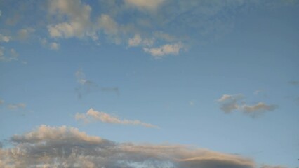 Poster - fast-moving clouds in the sky in the evening.