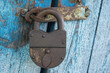 Big old  padlock. A rusty padlock. Lock on the door. The door is locked