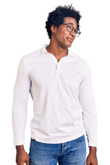 Poster - Handsome african american man with afro hair wearing casual clothes and glasses smiling looking to the side and staring away thinking.