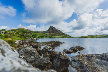 Immerse yourself in the serene beauty of Llynnau Cregennen, a stunning summer landscape in Wales.