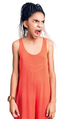 Wall Mural - Cute african american girl wearing casual clothes angry and mad screaming frustrated and furious, shouting with anger. rage and aggressive concept.