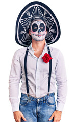 Poster - Man wearing day of the dead costume over background puffing cheeks with funny face. mouth inflated with air, crazy expression.