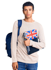 Poster - Young african amercian man wearing student backpack holding binder and uk flag thinking attitude and sober expression looking self confident