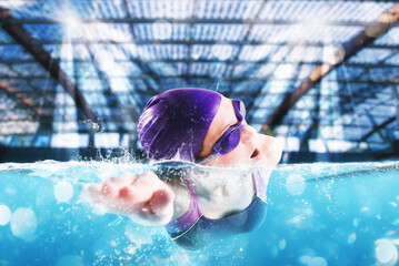 Sporty woman athlete swims with energy during a competition in the pool