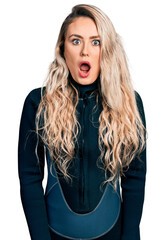 Sticker - Young blonde woman wearing diver neoprene uniform afraid and shocked with surprise and amazed expression, fear and excited face.