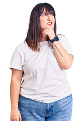 Sticker - Young plus size woman wearing casual clothes thinking worried about a question, concerned and nervous with hand on chin