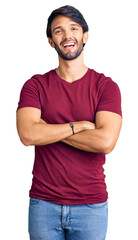 Poster - Handsome hispanic man wearing casual clothes happy face smiling with crossed arms looking at the camera. positive person.