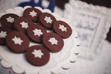 Tasty Chocolate Cookies Covered With White Icing Stars. Holiday Candybar For Guests. Birthday Dessert Celebration Candybar. Delicious Festive Star Fall. Delicious Sweet Cookies.