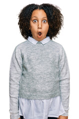 Wall Mural - Young little girl with afro hair wearing casual clothes afraid and shocked with surprise expression, fear and excited face.