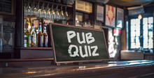 View Of A Pub With A Chalk Board On The Counter That Says Pub Quiz