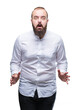 © Krakenimages.com - Young caucasian hispter man over isolated background afraid and shocked with surprise expression, fear and excited face.