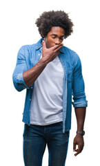 Poster - Afro american man over isolated background bored yawning tired covering mouth with hand. Restless and sleepiness.