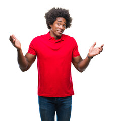 Canvas Print - Afro american man over isolated background clueless and confused expression with arms and hands raised. Doubt concept.