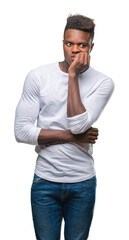 Wall Mural - Young african american man over isolated background looking stressed and nervous with hands on mouth biting nails. Anxiety problem.