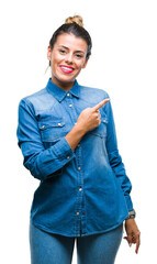 Sticker - Young beautiful woman over isolated background cheerful with a smile of face pointing with hand and finger up to the side with happy and natural expression on face looking at the camera.