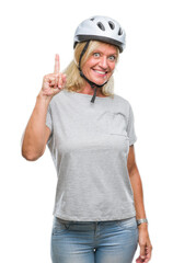 Canvas Print - Middle age caucasian cyclist woman wearing safety helmet over isolated background pointing finger up with successful idea. Exited and happy. Number one.