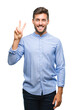 © Krakenimages.com - Young handsome man over isolated background showing and pointing up with fingers number two while smiling confident and happy.