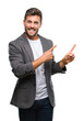 © Krakenimages.com - Young handsome business man over isolated background smiling and looking at the camera pointing with two hands and fingers to the side.